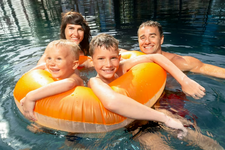 Family enjoy swimming.
